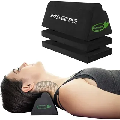 Person lying on back using a black cervical traction block, with stacked blocks labeled “Shoulders Side” above.