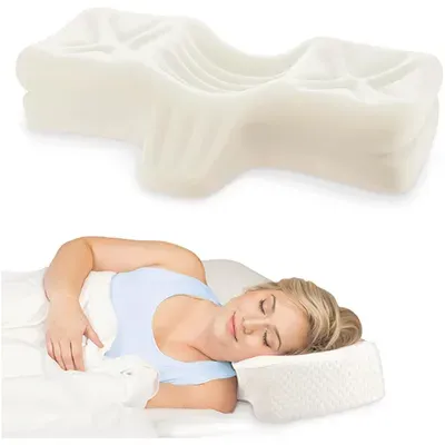 White orthopedic foam pillow shown above a person lying on side with head supported on a contoured pillow.