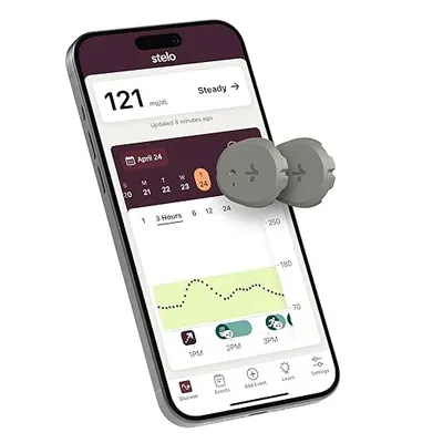 Smartphone displaying a glucose monitoring app showing 121 mg/dL with a small round sensor device beside it.